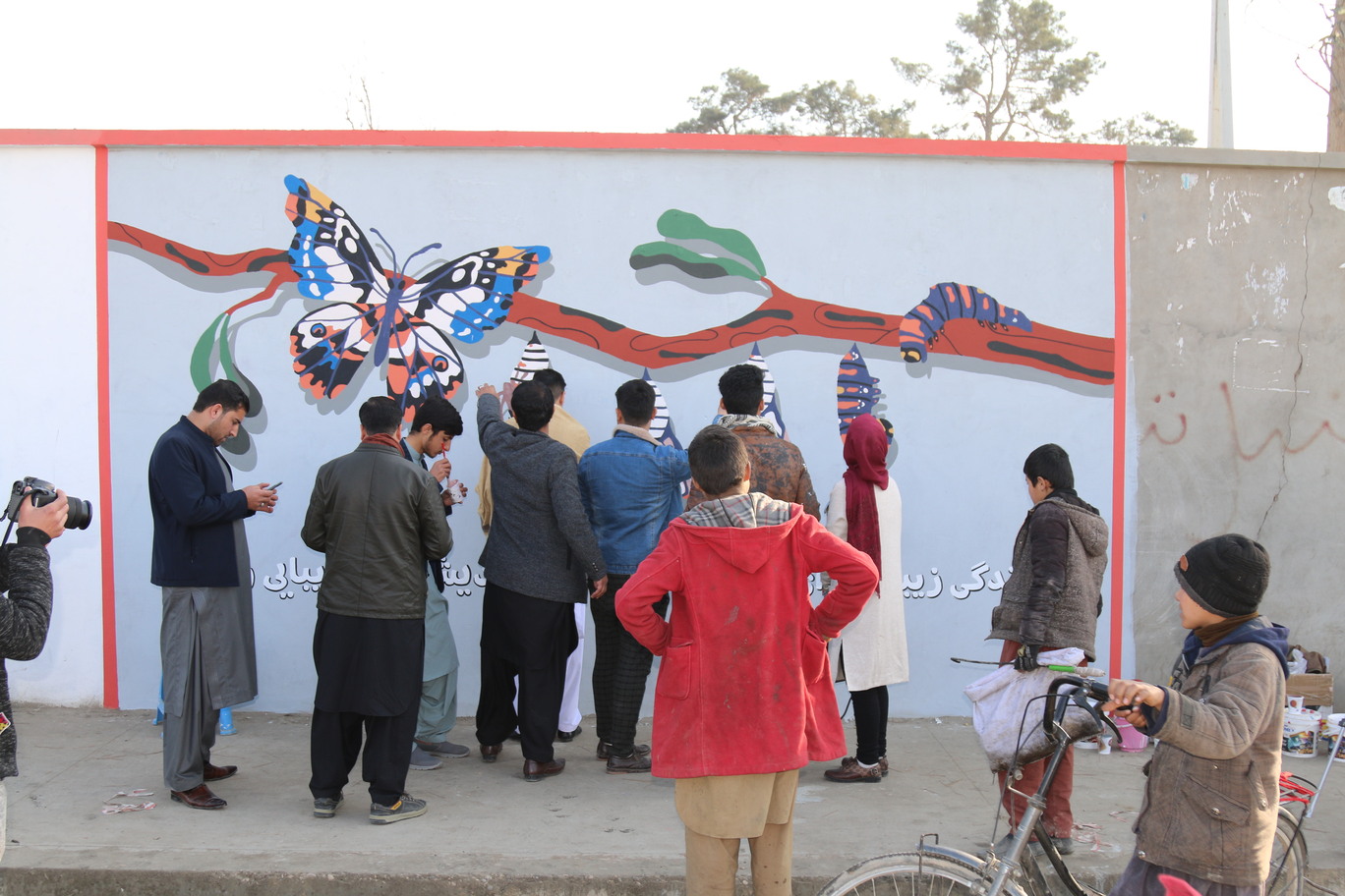 Afghans painting together as part of ArtLords street initiative